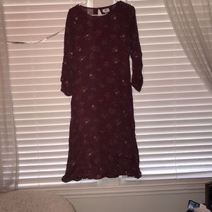 Burgundy mid calve length dress.
